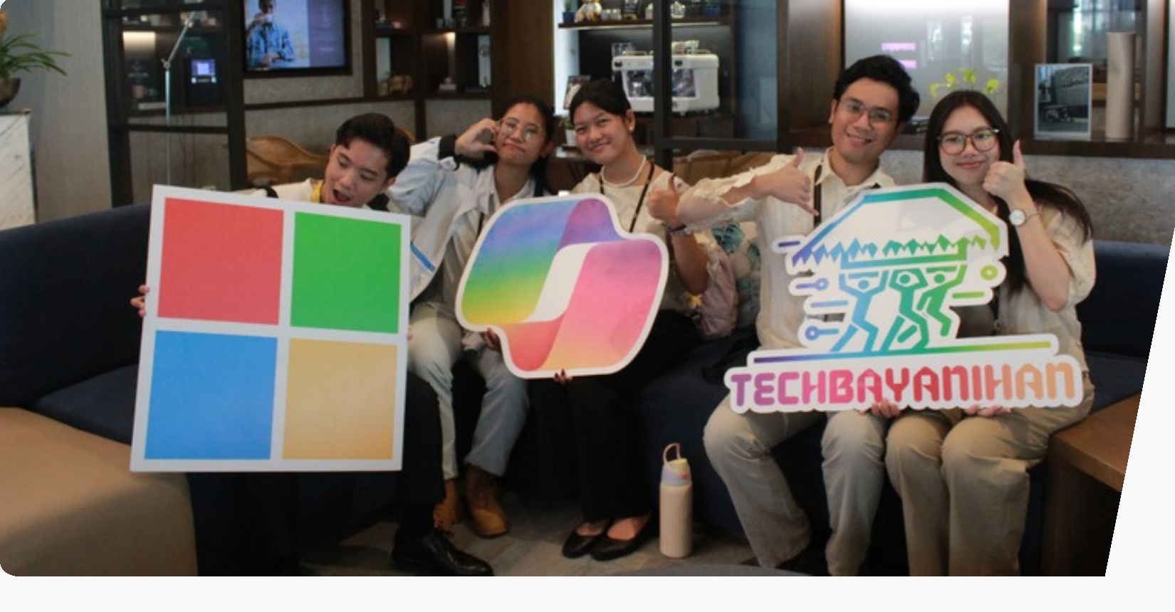 Techbayanihan community members holding Microsoft and Techbayanihan signs